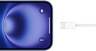 Przewód USB-C podłączony do iPhone’a 16 w kolorze ultramaryny